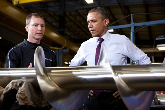 President Barack Obama looks at an agricultural auger in Cedar Rapids