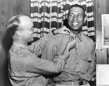 Image: African American soldier receiving insignia at Tuskegee Army Air Field
