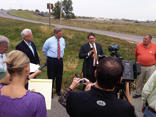 Iowa Congressman Leonard Boswell, U.S. Agriculture Secretary Vilsack and President of the Iowa State Building and Construction Trades Council, Bill Gerhard discuss efforts to strengthen the Iowa economy at the Des Moines Morningstar Bridge. 
