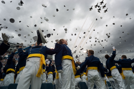 Graduates toss their hats as the Thunderbirds flyover during the United States Air Force Academy commencement ceremony (May 23, 2012)