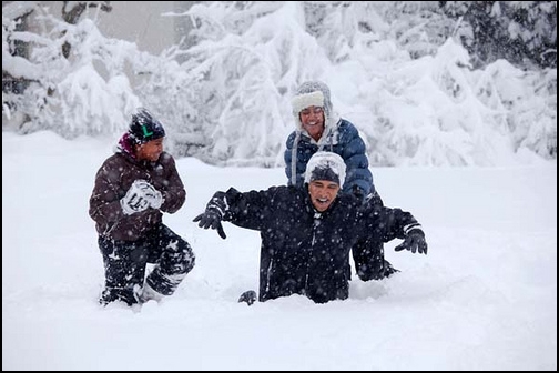 The President playing with his Daughters in the Snow