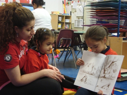 Jumpstart children and Corps Member read "Make Way for Ducklings" 