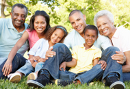 multigenerational family sitting outdoors