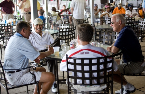 After playing a round of golf, President Barack Obama has a drink with Vice President Joe Biden