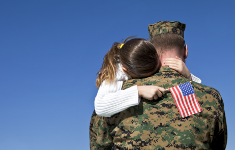 photo of soldier hugging daughter
