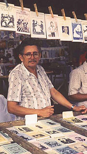 Apolônio Alves dos Santos at his poetry stand.