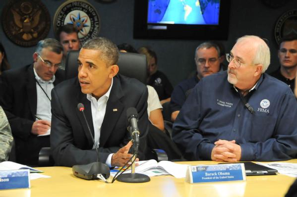 Washington, D.C., Oct. 28, 2012 -- President Barack Obama participates in a briefing with federal agency partners on preparations for Hurricane Sandy at FEMA's National Response Coordination Center. At right is FEMA Administrator Craig Fugate. FEMA/Aaron Skolnik 