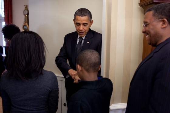 President Barack Obama greets the Sinkfield family in the Outer Oval Office