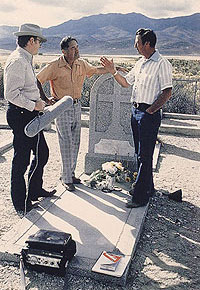Dan and Bruno Ramasco talking being interviewed by Howard Marshall beside a grave