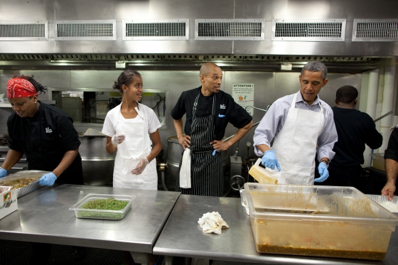 President Barack Obama and daughter Malia Obama participate in a service project at DC Kitchen