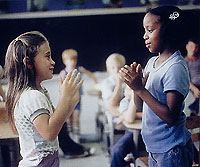 Fourth grade girls, playing a hand-clapping game