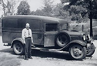 Herbert Halpert in front of a truck