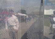 Reflection of a Vietnam Veterans of America representative in the Wall that Heals.