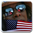 John Kerry website. Woman holding a US flag