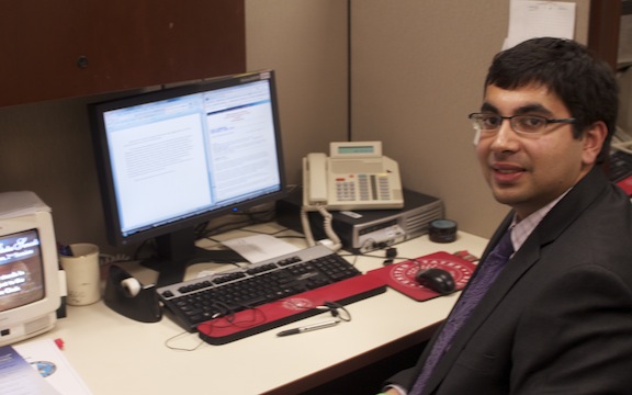 Mohammad at his desk in the office