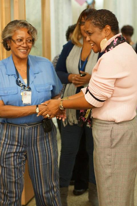 Photo: Acting Public Printer Davita Vance-Cooks greets employees arriving for the Breast Cancer Awareness event.
