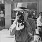 Tourist using candid camera, Taos, New Mexico, 1940.
