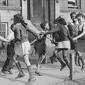 Children playing 'ring around a rosie' in Chicago, 1941.