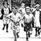 Photo of children running toward the camera