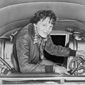 Amelia Earhart checks her equipment