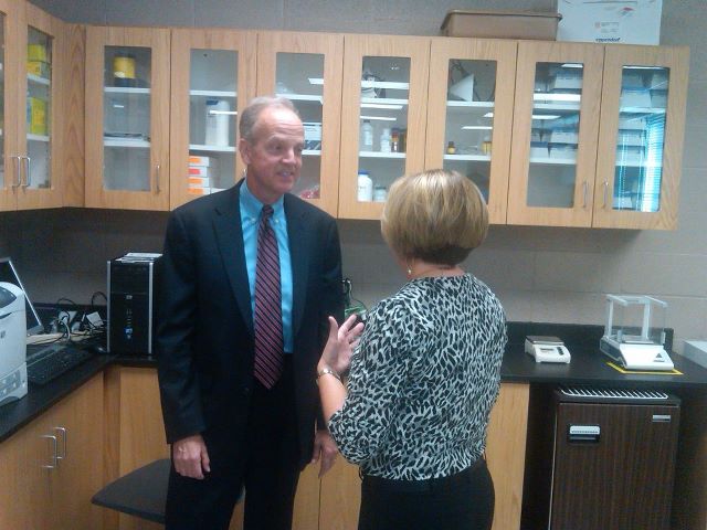 Photo: Visiting with Dr. Tricia Paramore, the department chair for the Natural Science and Mathematics Department, during her Biology I Lab at HCC.