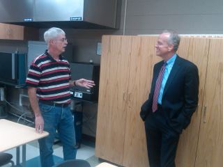 Photo: Visiting with Dr. Chuck Buller, chemistry instructor, in the biotech lab at HCC's Richard E. Smith Science Center.