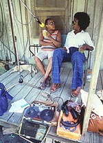 Folklorist Beverly Robinson (right) interviewing Jessie Lee Smith, on the porch of his home, Tifton, Georgia, August, 1977.