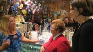 Photo: Senator Mikulski and Councilwoman Watson meet with the owner of Discoveries, a small business on Ellicott City's historic Main Street.