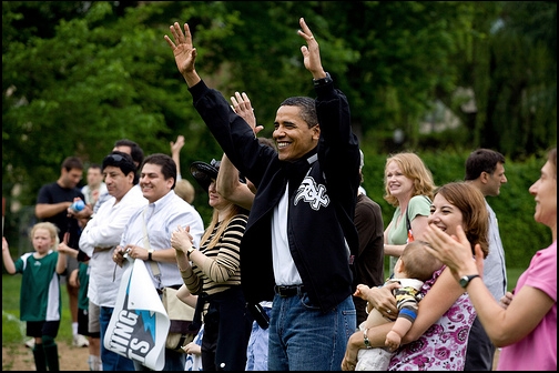 President Barack Obama cheers for his daughter Sasha's soccer team
