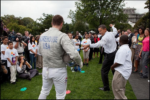 President Barack Obama parries with fencer Tim Morehouse