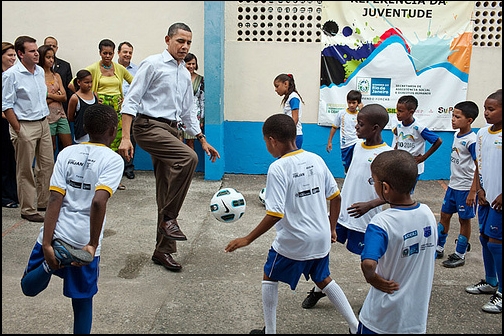 The President plays soccer with children