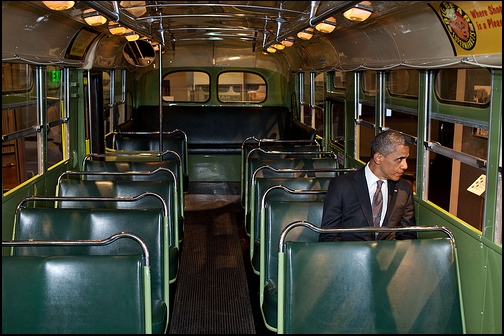 President Barack Obama sits on the Rosa Parks bus