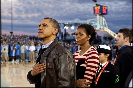 The President and the First Lady watch the retiring of the colors
