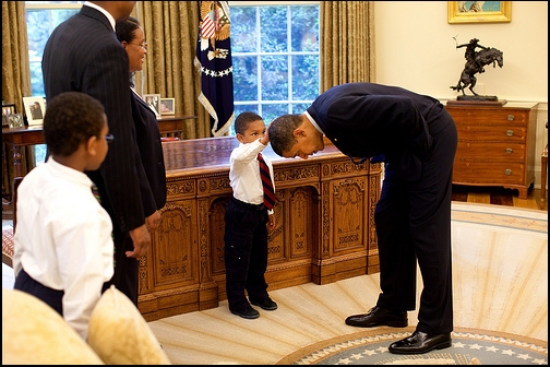 President Barack Obama bends over