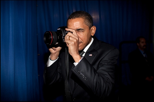 President Barack Obama takes a picture