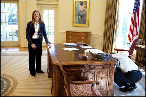 President Barack Obama examines the Resolute Desk 