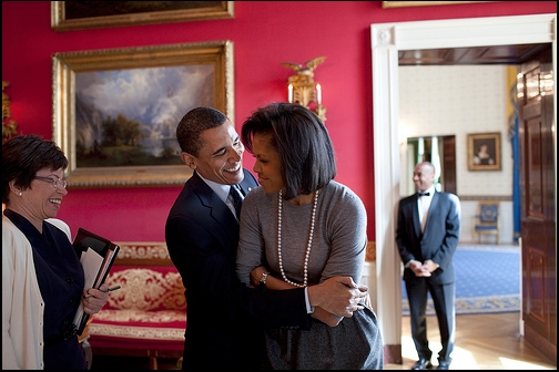 President Barack Obama hugs First Lady Michelle Obama in the Red Room