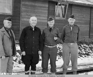 Photo: Governor Gruening, in black, was in Whitehorse when the highway was completed in late October 1942.