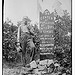 The Center of Population of U.S. [man standing next to memorial stone] (LOC)