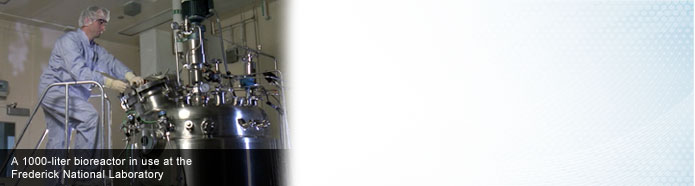 A worker adjusts the 1000-liter bioreactor in use at Frederick National Laboratory in Maryland