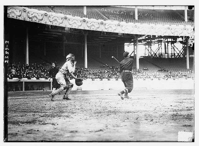 [Fred Merkle (New York NL) at bat, Red Murray (New York NL) walking in background, and unidentified catcher at the Polo Grounds, NY, 1911 World Series (baseball)] (LOC)