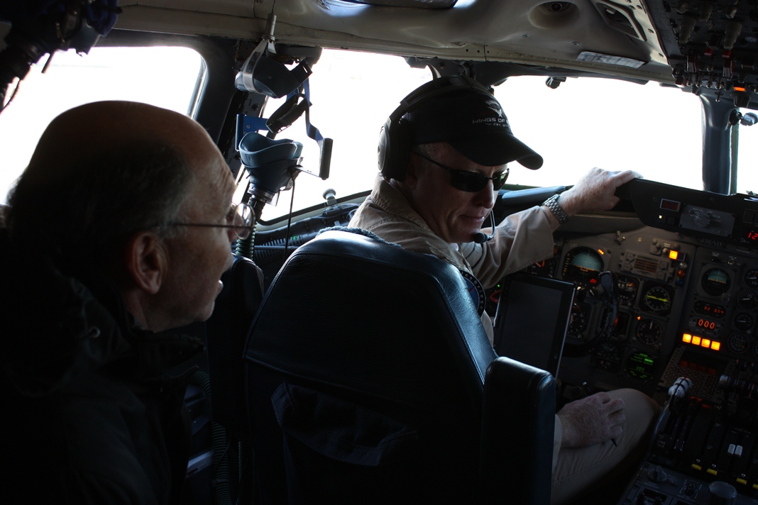 Ambassador Wolff in the DC-8 cockpit shortly after takeoff on Oct. 25.