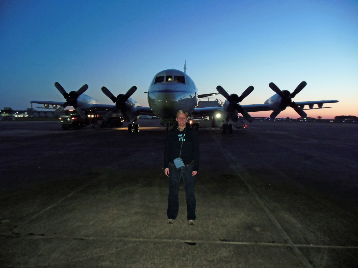 Christy Hansen stands in front of an airplane at Wallops Flight Facility in Virginia. This plane took her to Greenland this past April. 