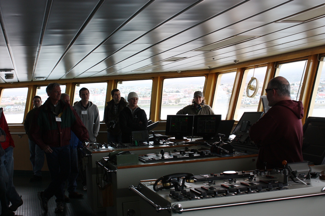 Captain Sebastian Paoni talks to IceBridge people on the bridge