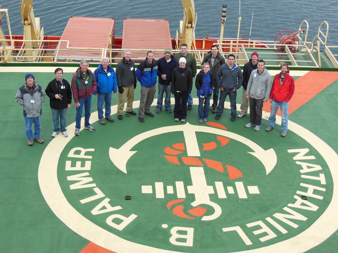 Palmer visitors stand on the helipad on the Palmer's stern