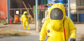 People in chemical protective gear responding to chemical emergency
