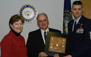 Photo: Senator Shaheen presented Gulf War veteran and Dover resident James Thuber with military service medals at ceremony in Dover. James enlisted in the Air Force at the age of 24 and was an expert on aircraft technology. He was stationed in Saudi Arabia during the Gulf War, where analyzed performance for the F-117A Stealth Fighter Aircraft. Pictured from left to right are Senator Shaheen, Mr. James Thurber and Chief Master Sergeant Michael Krall. (November 8, 2012. Dover, NH.)