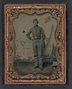[Unidentified soldier in Union uniform with cavalry saber in front of  U.S. Picture Tent painted backdrop showing military camp scene] (LOC) by The Library of Congress