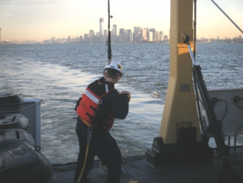As the sun comes up in New York this morning, Ensign Lindsey Norman retrieves the side scan sonar that NOAA Ship Thomas Jefferson used to survey the Hudson River, so fuel barge traffic could resume.