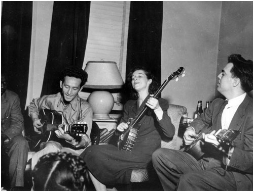 Sonny Terry (obscured), Woody Guthrie, Lilly Mae Ledford, Alan Lomax, New York, 1944.